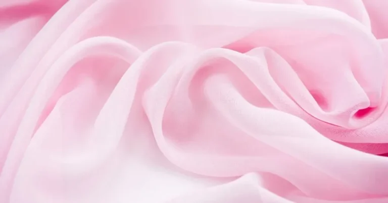 Sheer pink chiffon fabric draped in translucent layers