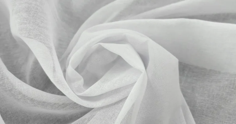Sheer white muslin fabric with a soft airy drape